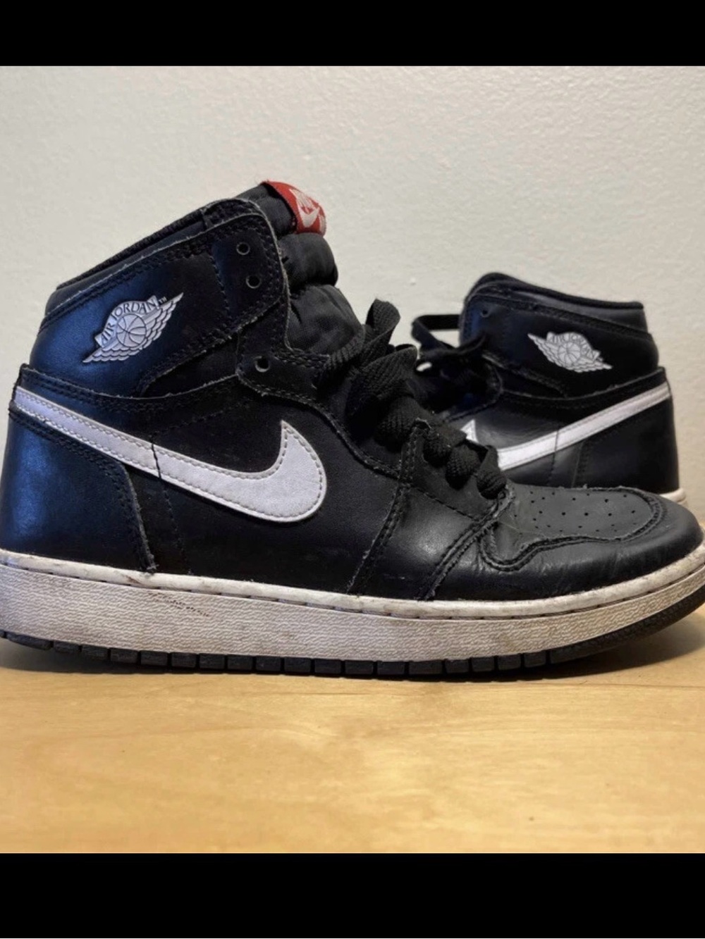 Nike Kids Black and White Mid-Top Sneakers with Red Tongue Accent